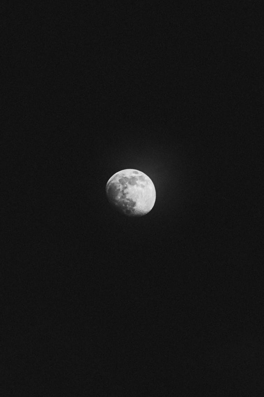 waxing gibbous moon on a dark sky
